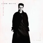 The Neon Ache: Why John Waite’s “Missing You” Still Echoes